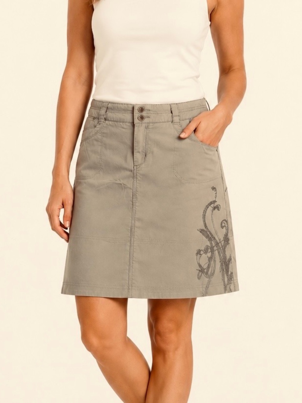 REI khaki, mini skirt with embroidered detail.